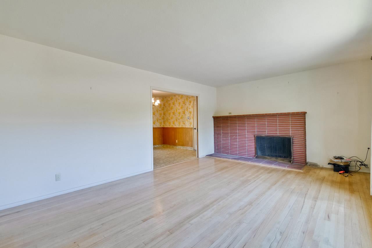 2738 Cramer Circle San Jose, CA 95111 - Photo 27 of 63 an empty room with wooden floor fireplace and windows