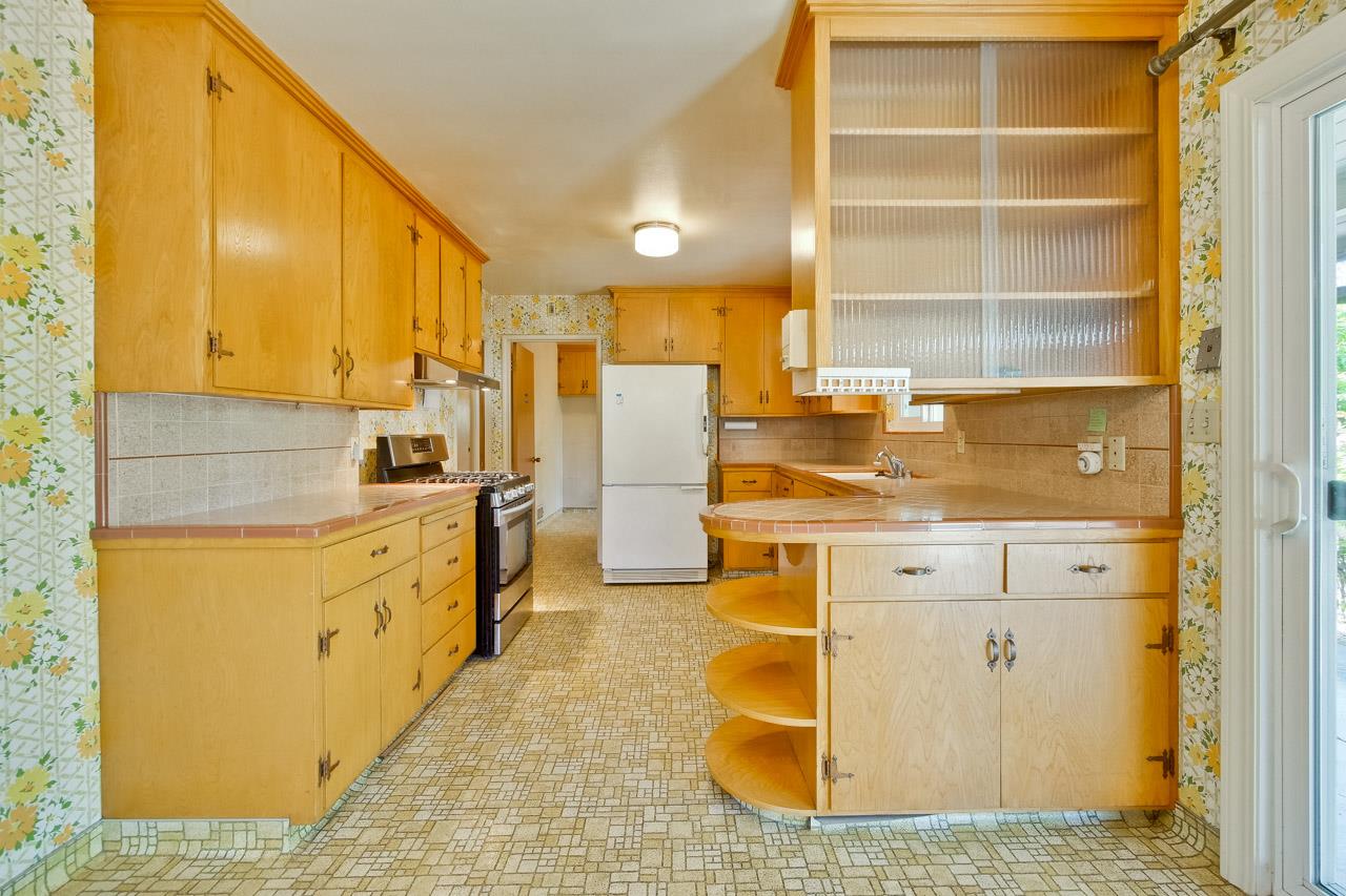 2738 Cramer Circle San Jose, CA 95111 - Photo 35 of 63 a kitchen with stainless steel appliances a stove refrigerator and cabinets