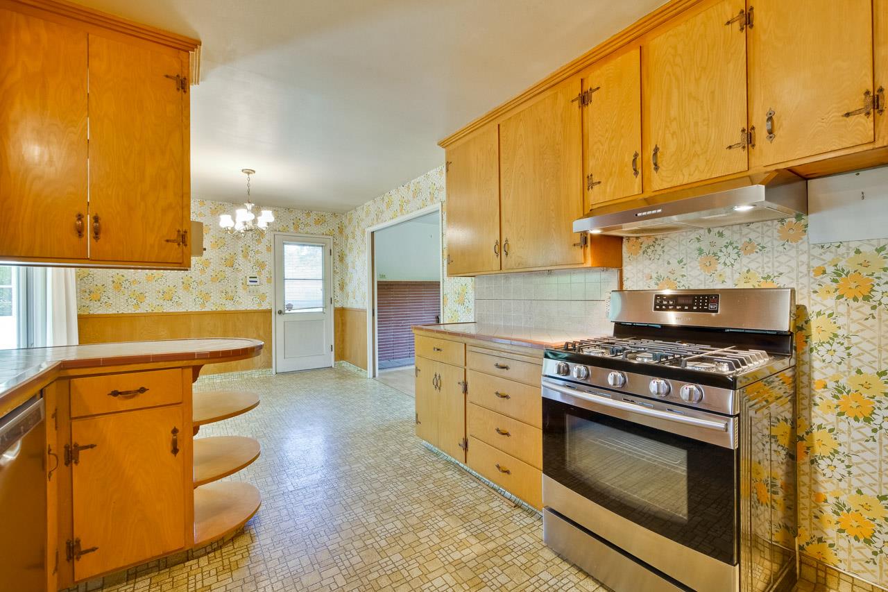 2738 Cramer Circle San Jose, CA 95111 - Photo 40 of 63 a kitchen with stainless steel appliances granite countertop a stove a sink and a microwave