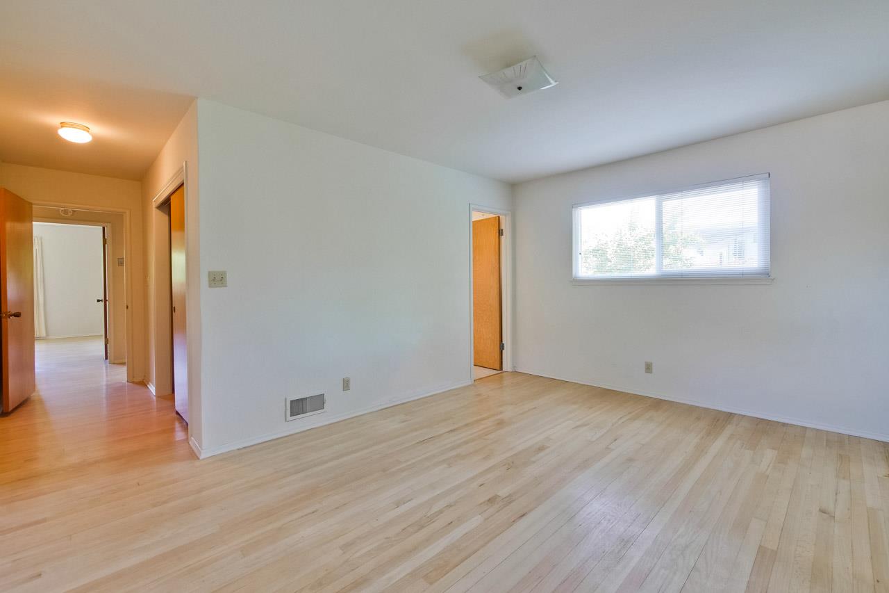 2738 Cramer Circle San Jose, CA 95111 - Photo 45 of 63 an empty room with wooden floor and windows
