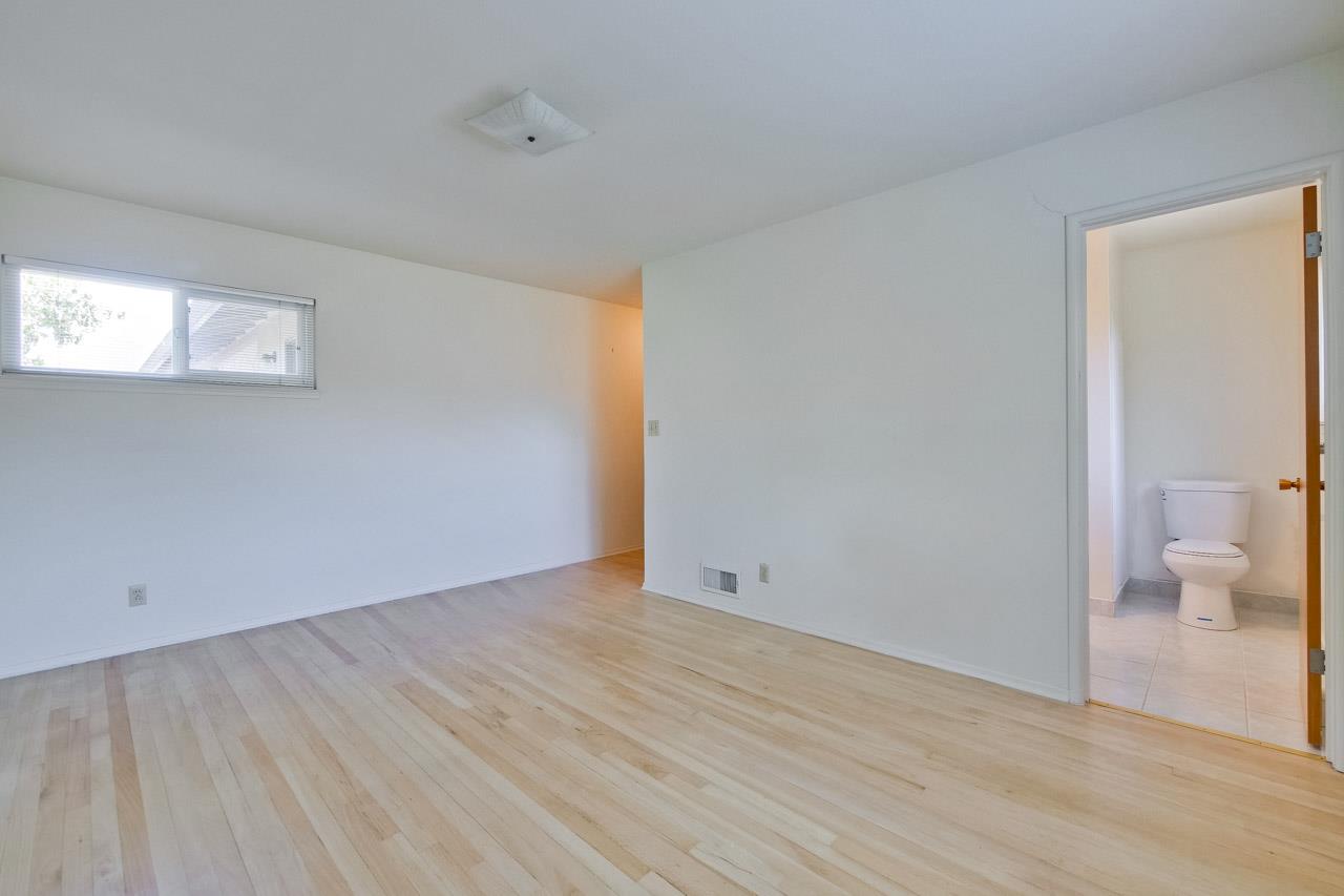 2738 Cramer Circle San Jose, CA 95111 - Photo 46 of 63 a view of an empty room with wooden floor and a toilet
