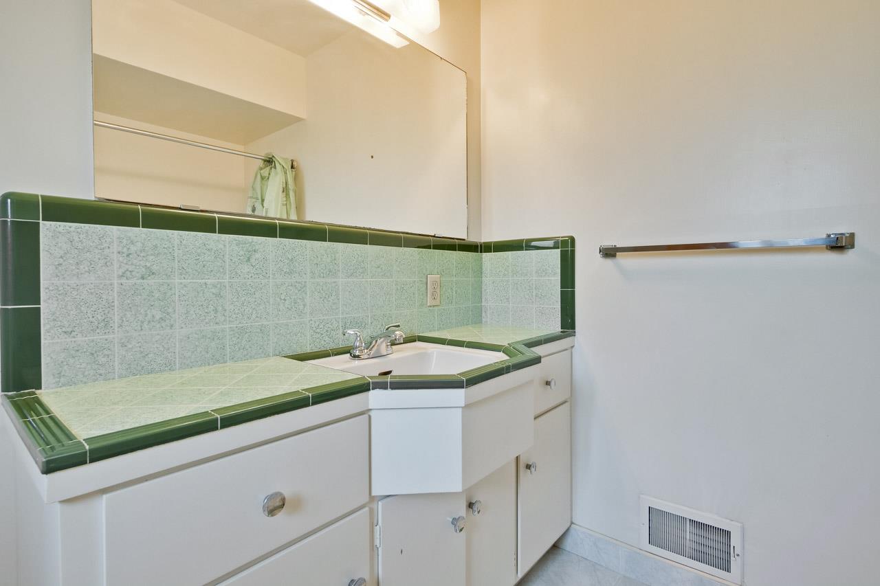2738 Cramer Circle San Jose, CA 95111 - Photo 49 of 63 a bathroom with a sink and a mirror