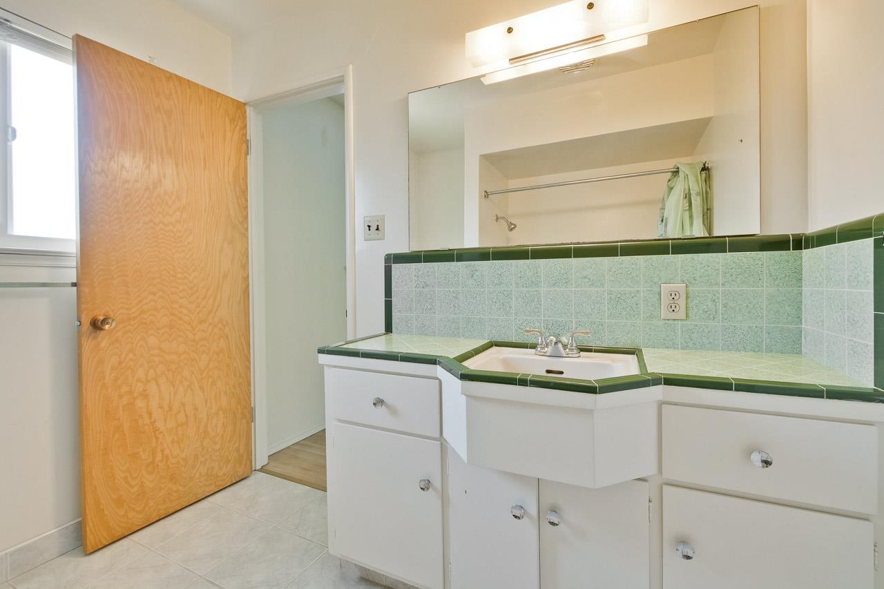 2738 Cramer Circle San Jose, CA 95111 - Photo 50 of 63 a bathroom with a sink and a mirror