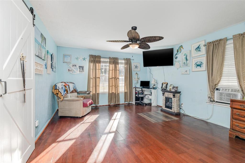 18888 Highway 274 Kemp, TX 75143 - Photo 13 of 30 a living room with furniture a flat screen tv and a window