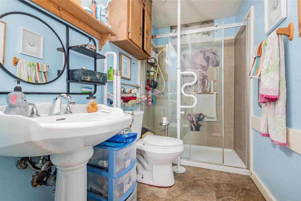 18888 Highway 274 Kemp, TX 75143 - Photo 16 of 30 a bathroom with a sink toilet and shower