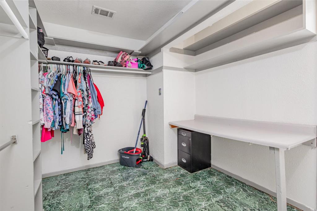 18888 Highway 274 Kemp, TX 75143 - Photo 17 of 30 a view of walk in closet with clothes and shoes