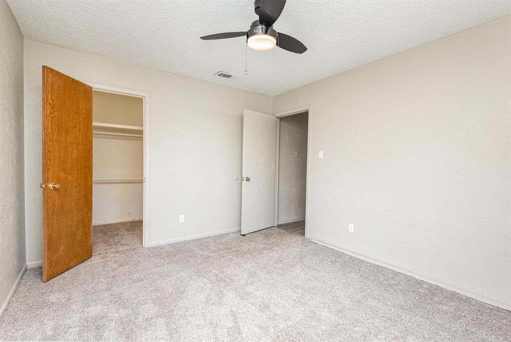 18888 Highway 274 Kemp, TX 75143 - Photo 23 of 30 a view of an empty room with a ceiling fan