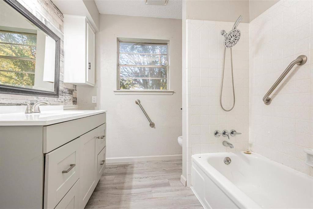 18888 Highway 274 Kemp, TX 75143 - Photo 24 of 30 a spacious bathroom with a tub sink and mirror