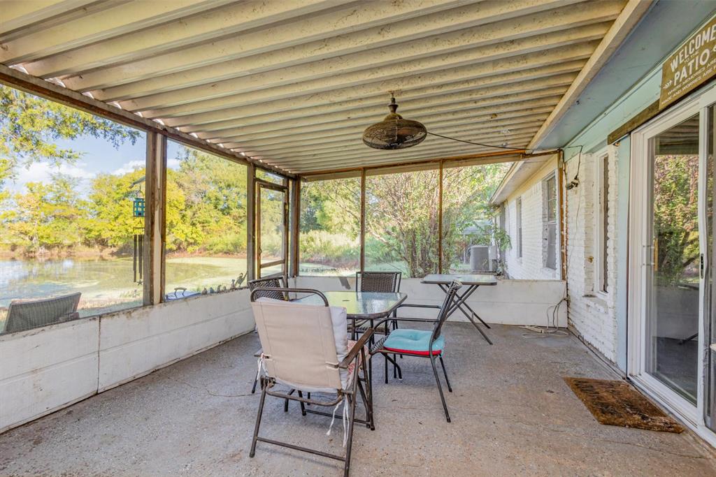 18888 Highway 274 Kemp, TX 75143 - Photo 26 of 30 a dining room with furniture and large windows