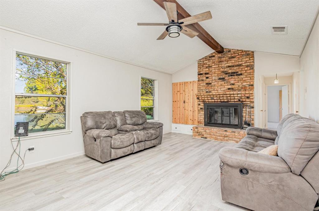 18888 Highway 274 Kemp, TX 75143 - Photo 5 of 30 a living room with furniture and a fireplace