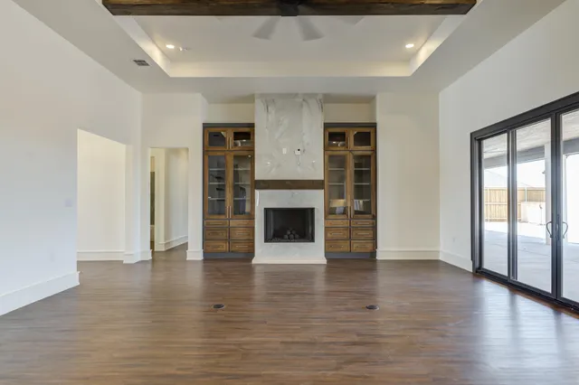 a bathroom with a toilet and a glass door