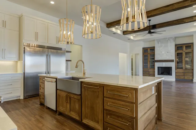 a spacious bathroom with a bathtub a sink and a mirror