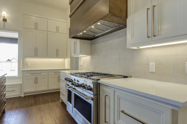 a bathroom with a double vanity sink a mirror and a shower