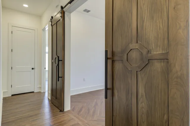 a living room with walk in closet and bathroom