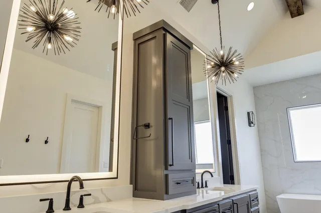 a kitchen with a sink cabinets and window