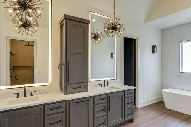 a bathroom with a sink and a mirror
