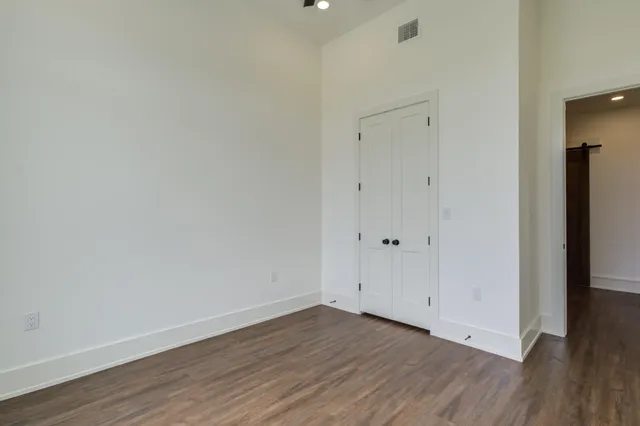 a kitchen with stainless steel appliances granite countertop a sink a stove and cabinets