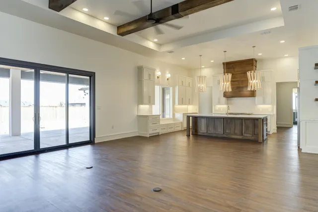 an empty room with wooden floor and closet