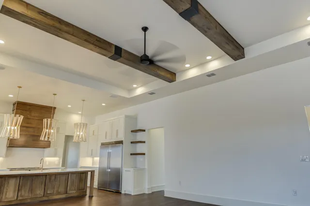 a stove top oven sitting inside of a kitchen