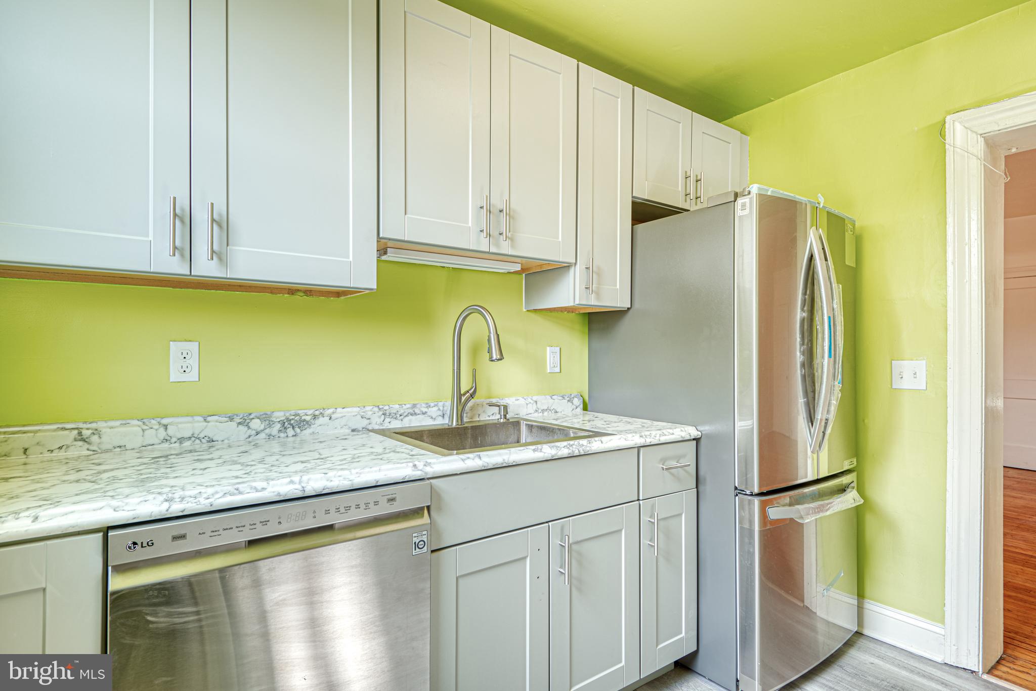 3621 Elkader Road Baltimore, MD 21218 - Photo 12 of 32 a kitchen with stainless steel appliances granite countertop a refrigerator sink and cabinets