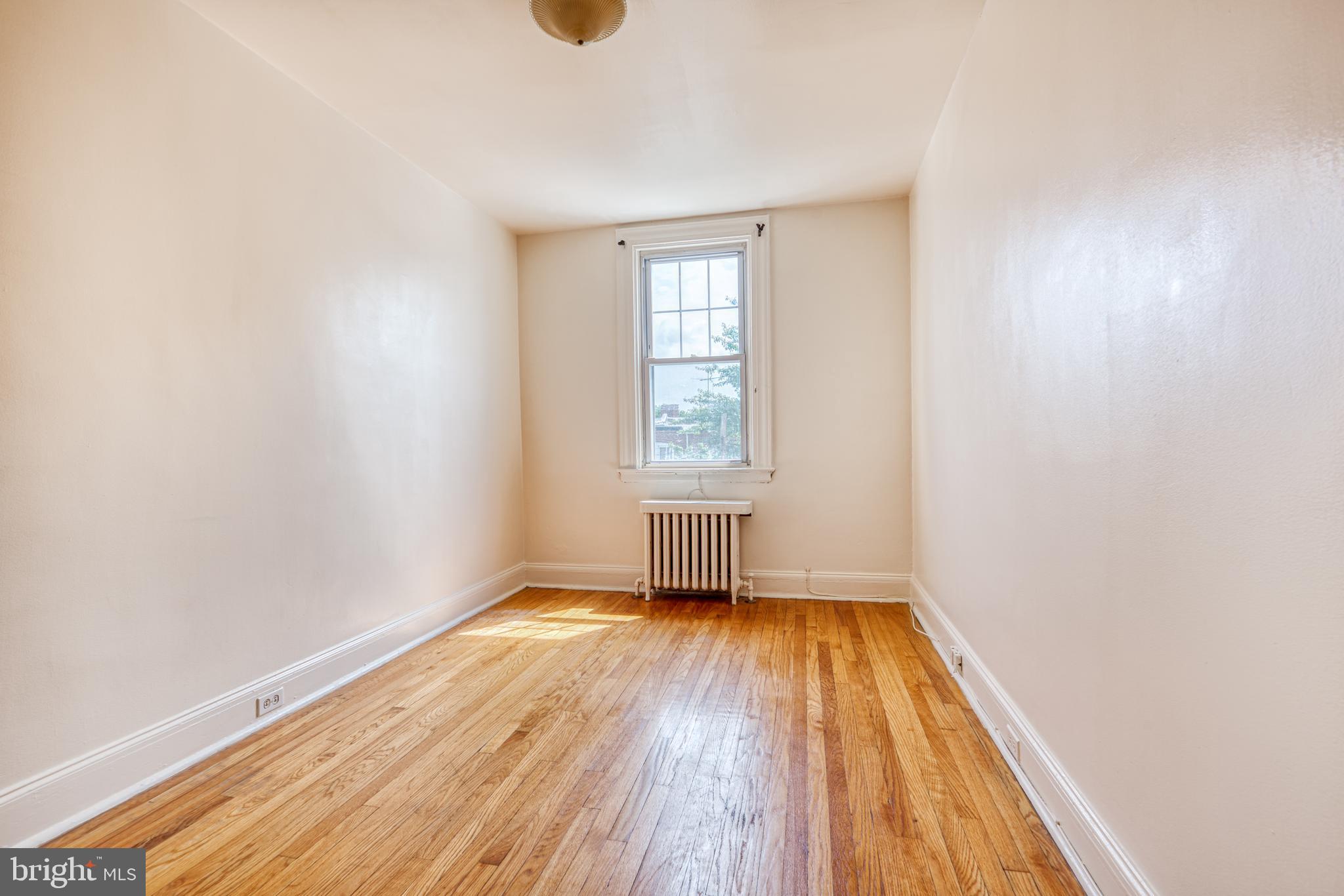 3621 Elkader Road Baltimore, MD 21218 - Photo 23 of 32 a view of a room with wooden floor and window