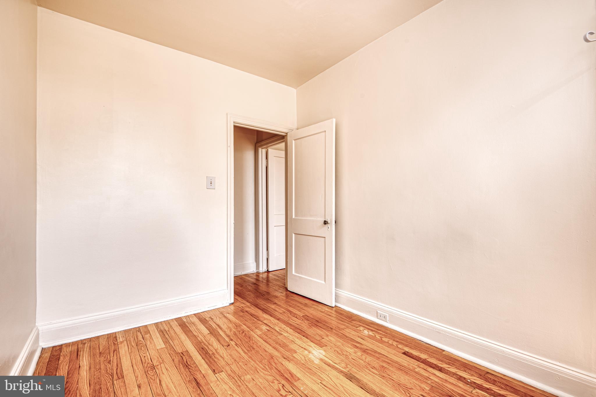 3621 Elkader Road Baltimore, MD 21218 - Photo 26 of 32 a view of an empty room with wooden floor