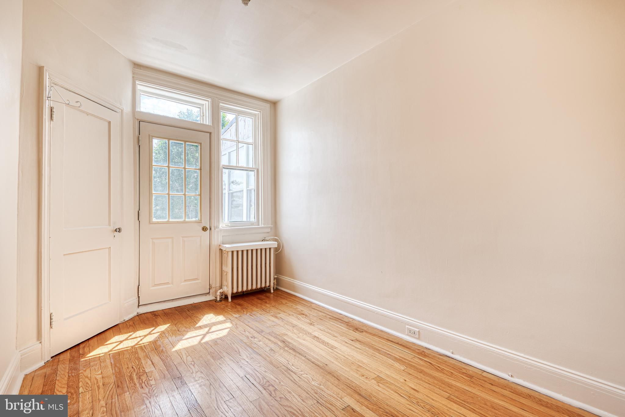 3621 Elkader Road Baltimore, MD 21218 - Photo 27 of 32 a view of empty room with wooden floor and fan