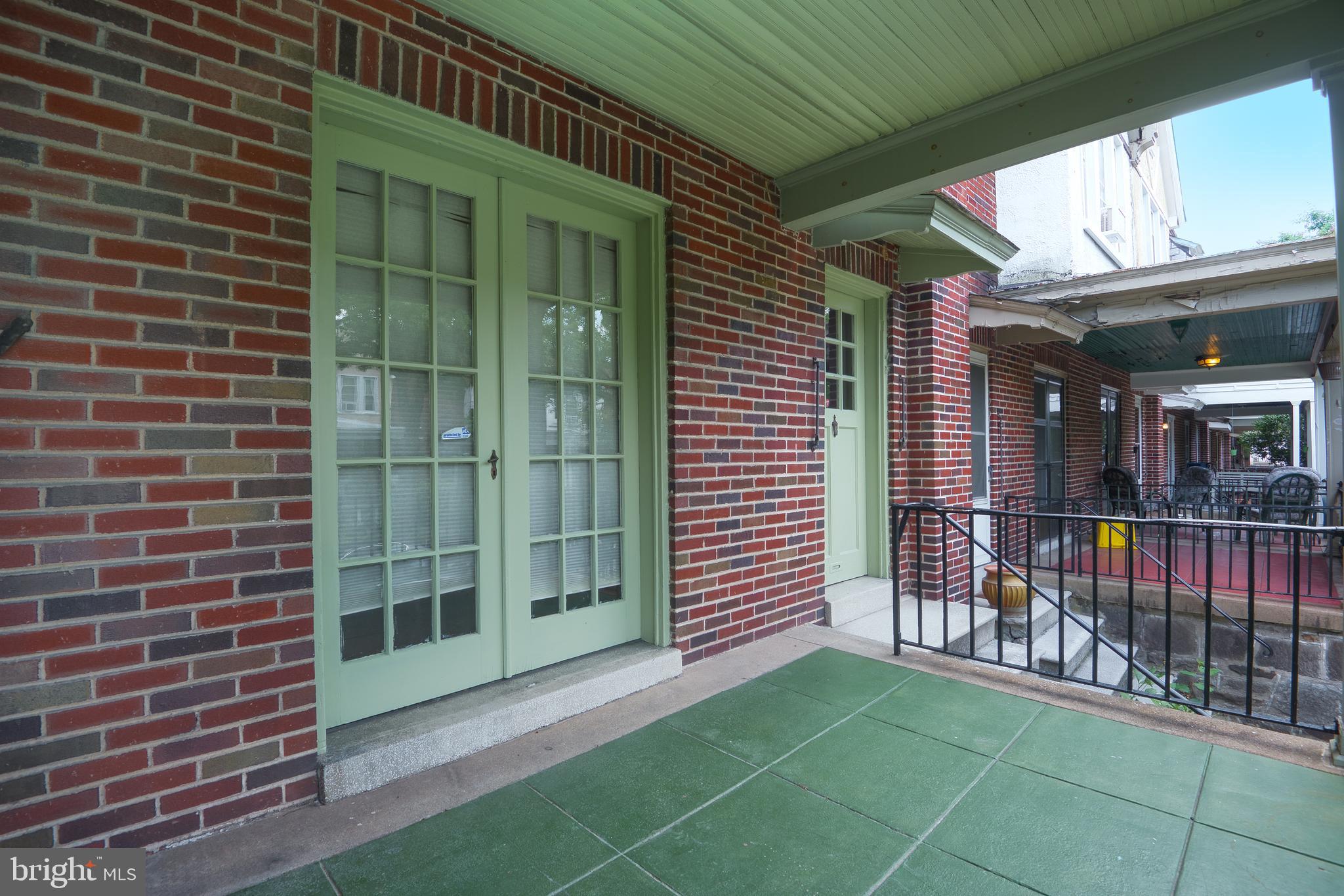 3621 Elkader Road Baltimore, MD 21218 - Photo 4 of 32 a view of a brick house with a large window