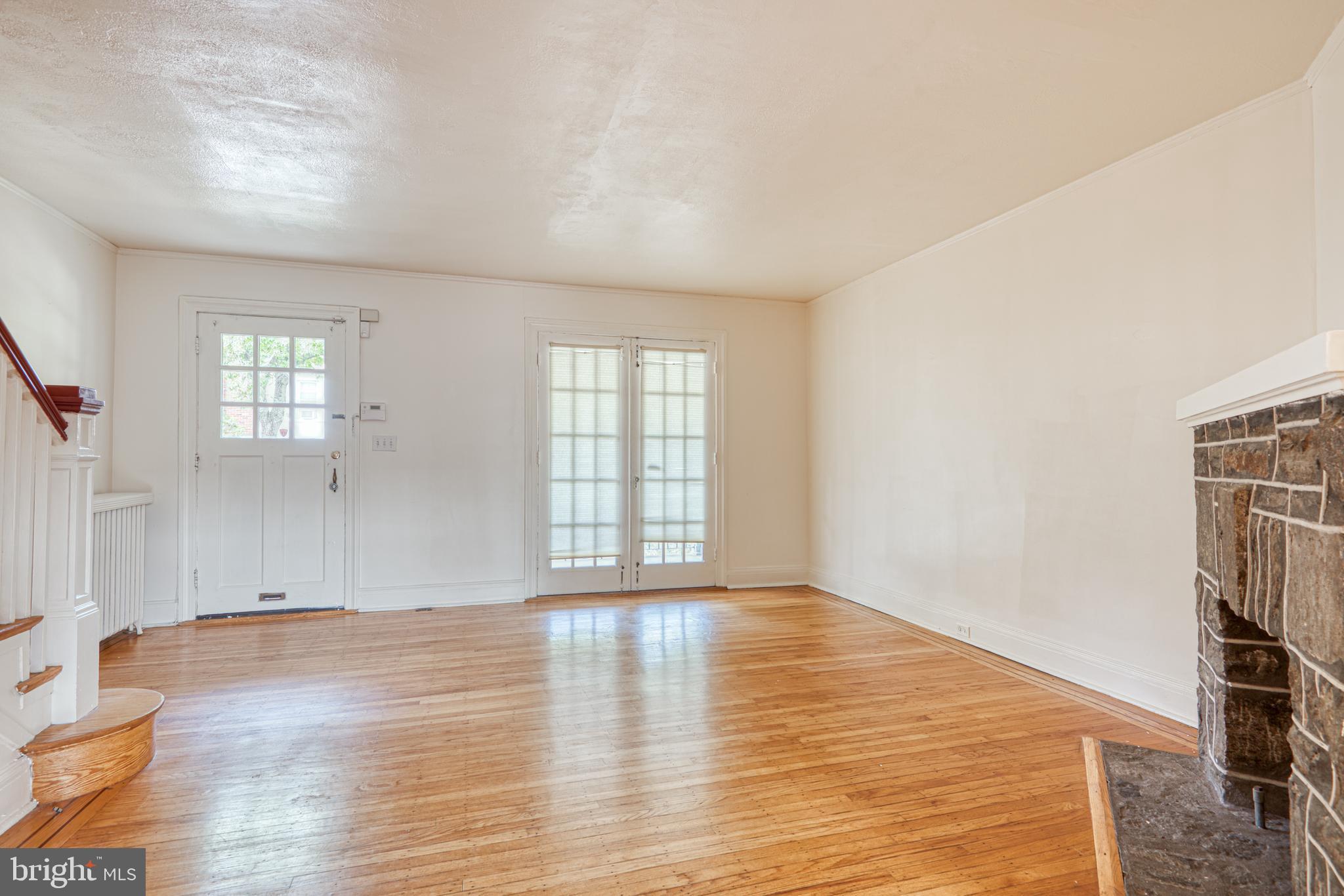 3621 Elkader Road Baltimore, MD 21218 - Photo 8 of 32 wooden floor in an empty room with a window