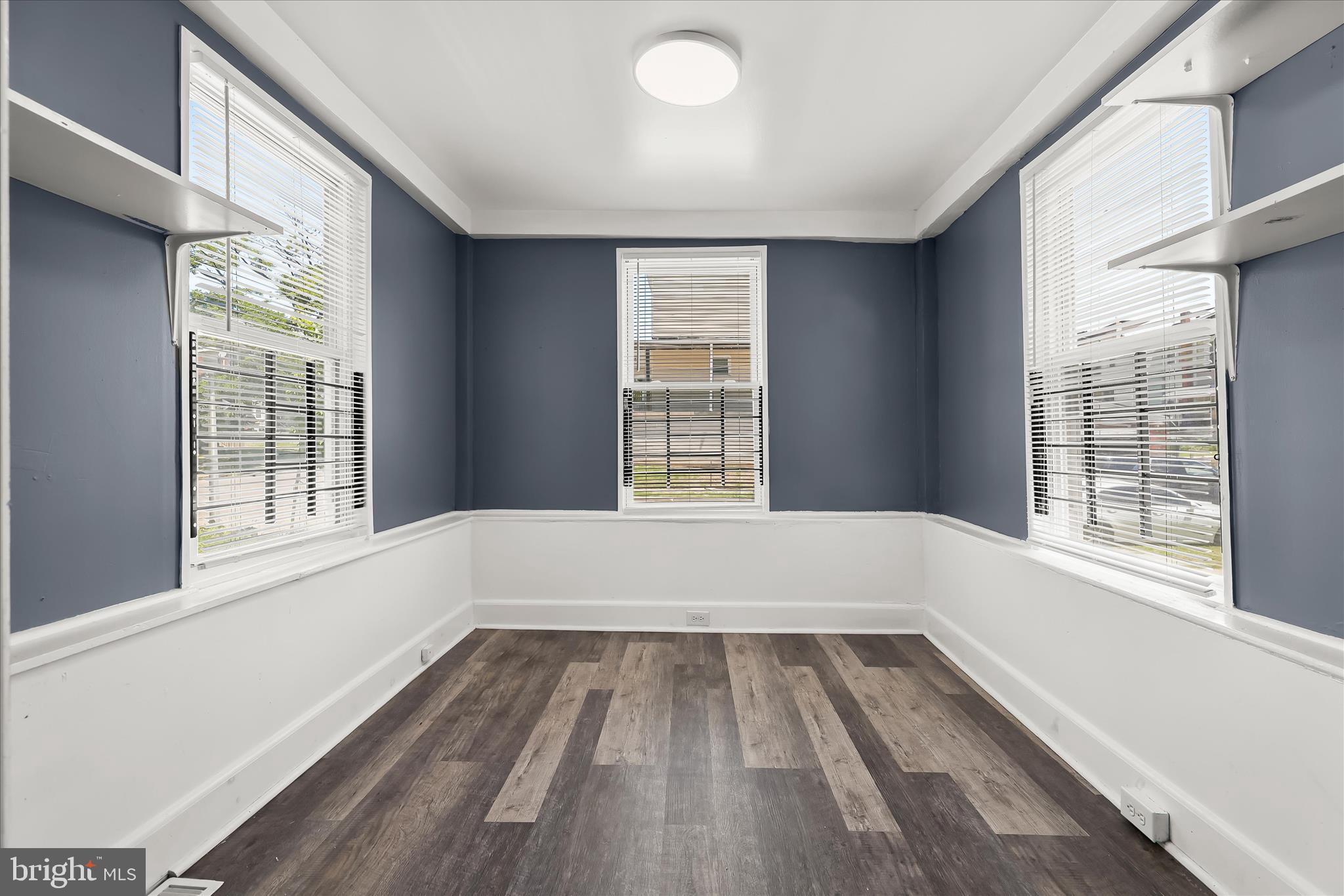 3534 Overview Road Baltimore, MD 21215 - Photo 10 of 28 a view of an empty room with wooden floor and a window