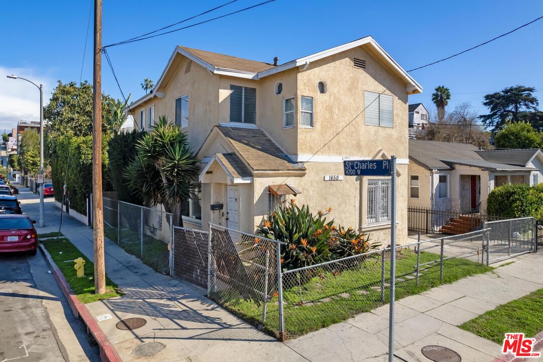 1650 South Rimpau Boulevard Los Angeles, CA 90019 - Photo 2 of 52 a view of a house front of house