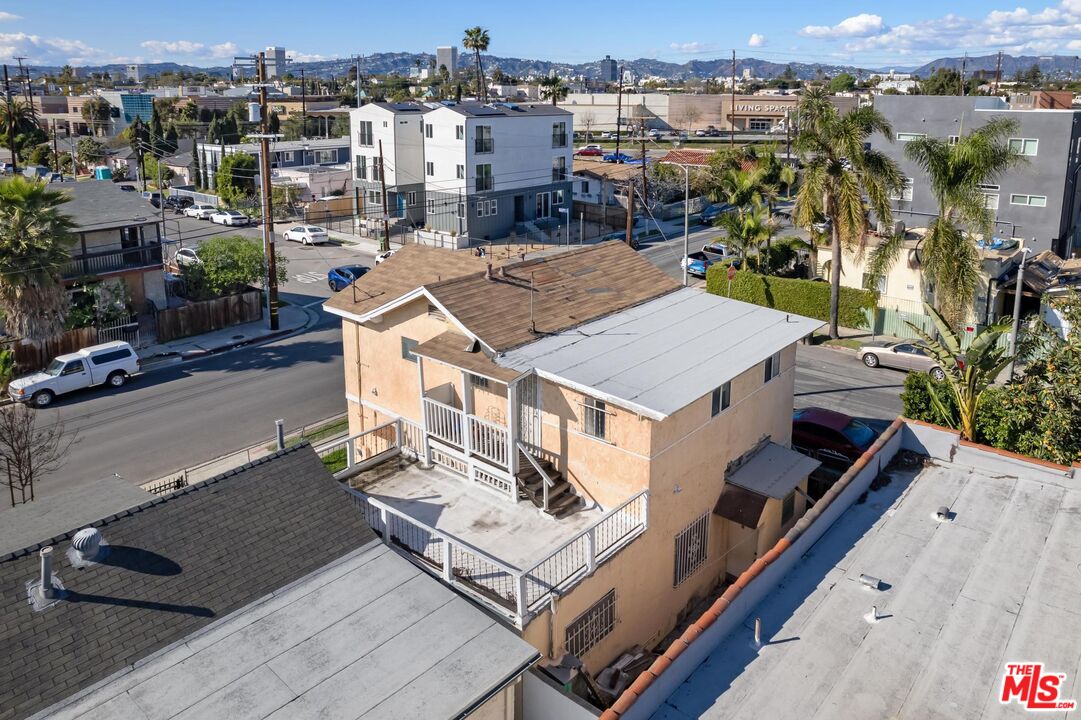 1650 South Rimpau Boulevard Los Angeles, CA 90019 - Photo 51 of 52 an aerial view of a house with a garden