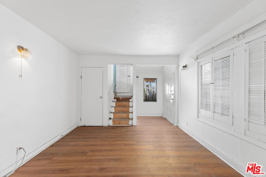 1650 South Rimpau Boulevard Los Angeles, CA 90019 - Photo 8 of 52 a view of empty room with wooden floor