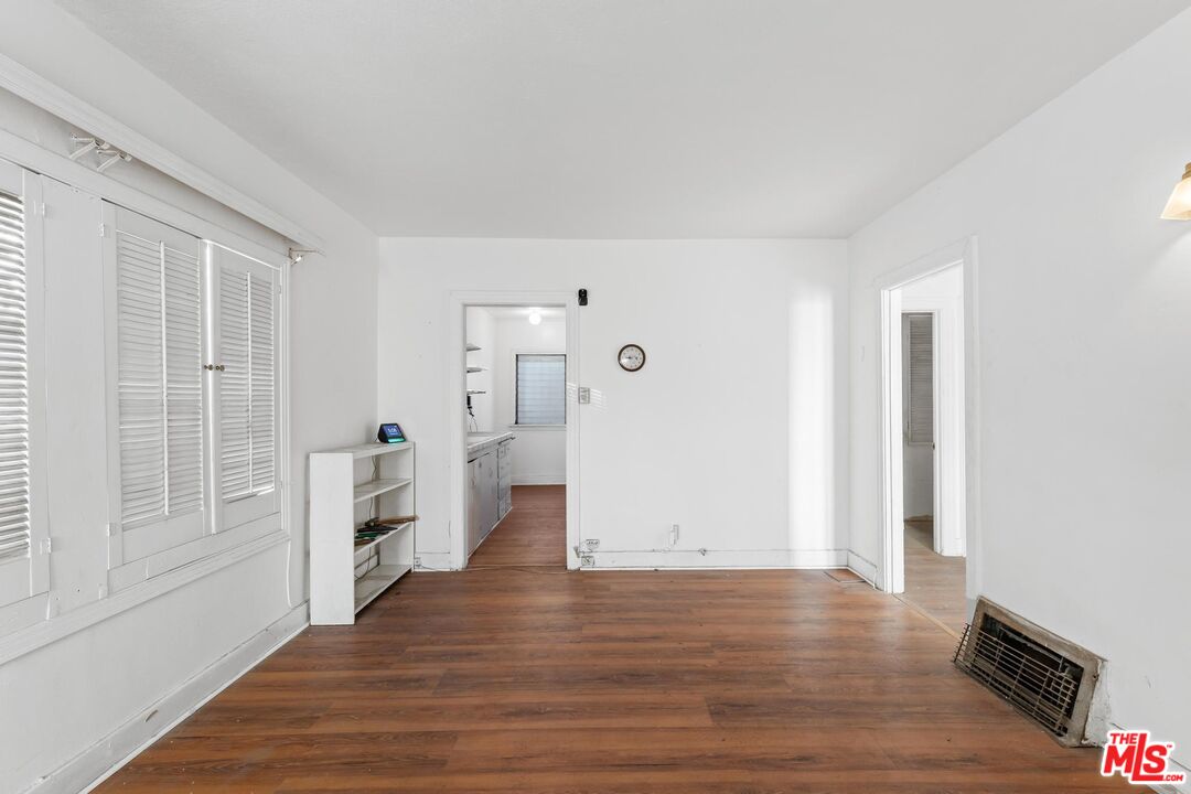 1650 South Rimpau Boulevard Los Angeles, CA 90019 - Photo 10 of 52 a view of empty room with wooden floor