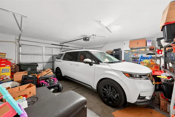 a porch with a table and chairs