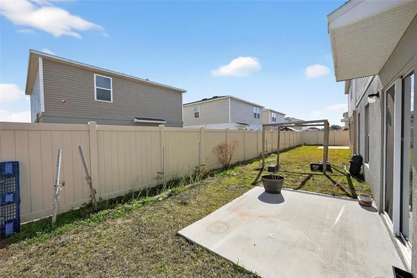 a view of a backyard with sitting area