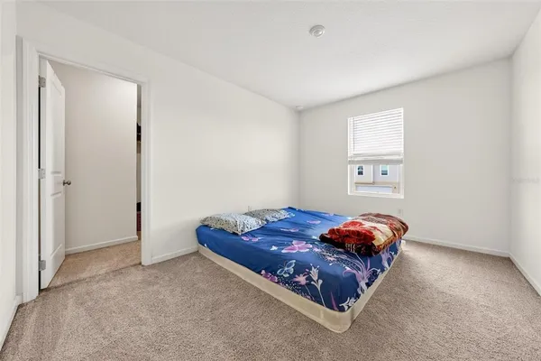 a room with a bed and a window