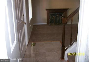 3017 Robin Ridge Court Fairfax, VA 22031 - Photo 6 of 19 foyer and fireplace in LR