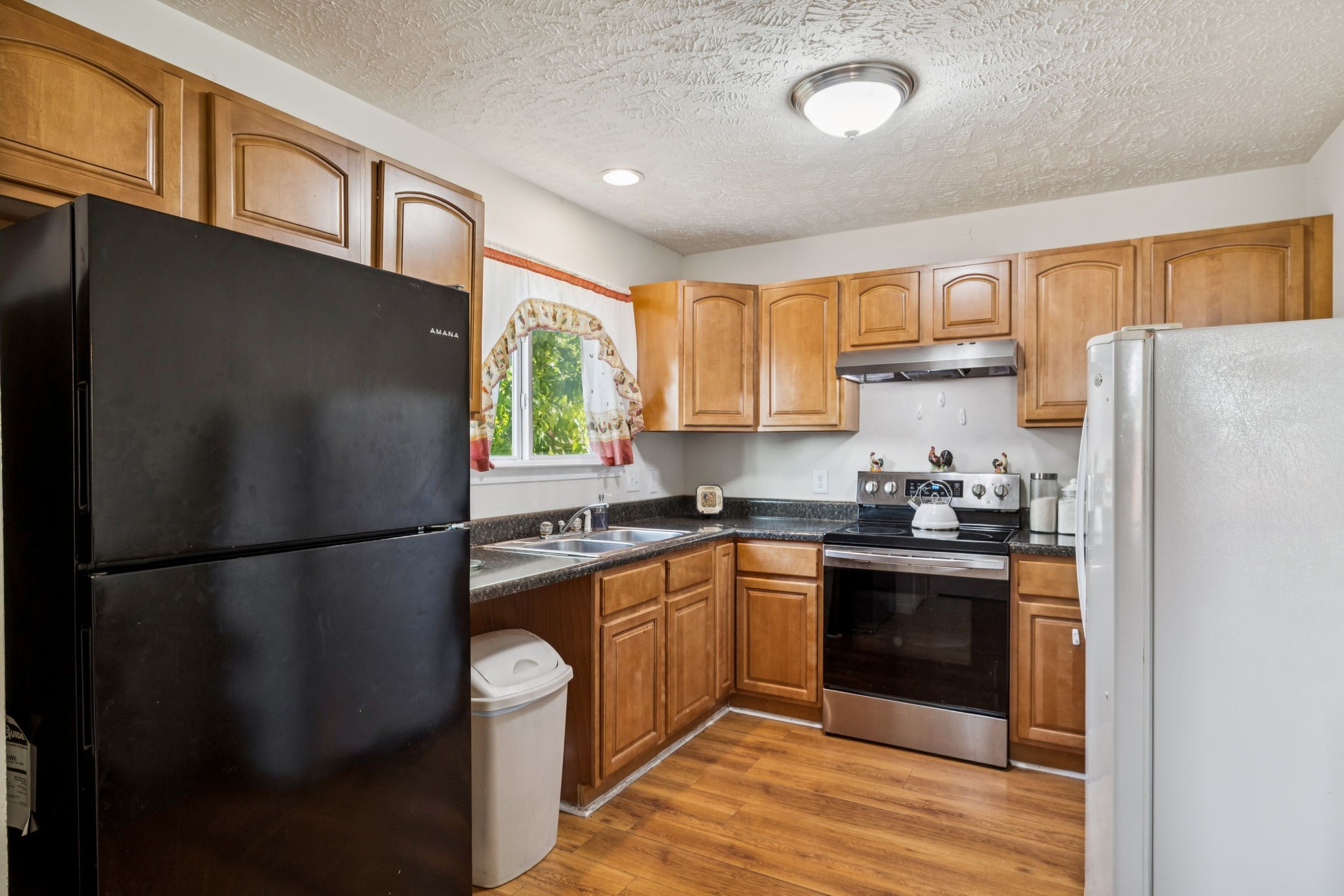 180 Strahl Street Franklin, TN 37064 - Photo 5 of 20 a kitchen with stainless steel appliances granite countertop a refrigerator a stove a sink and a refrigerator