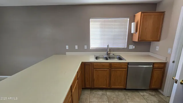 a kitchen with a sink and a window