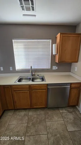 a kitchen with a sink and cabinets