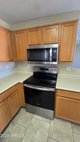 a kitchen with a stove and a microwave