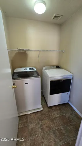 a utility room with washer and dryer
