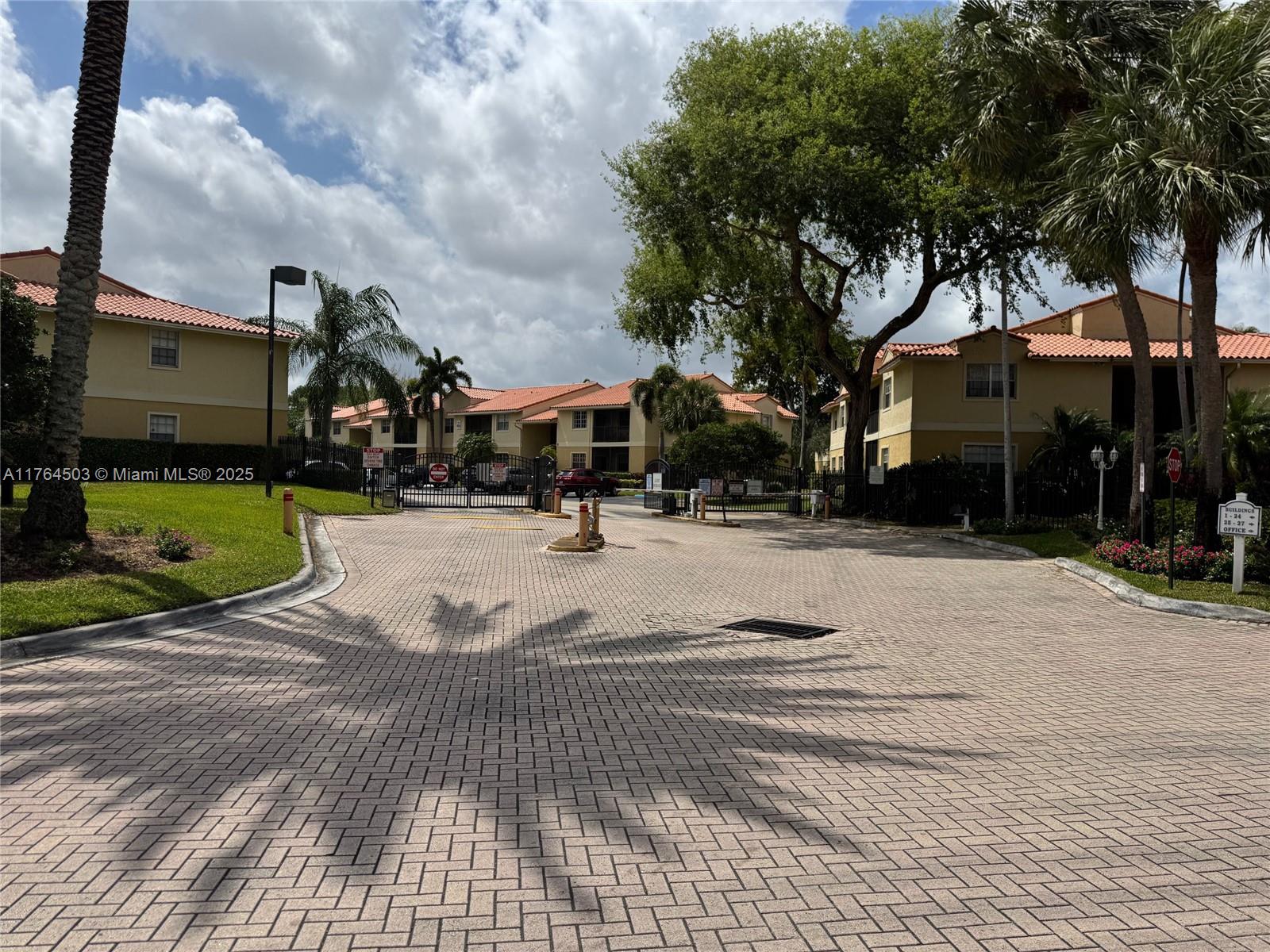 Royal Poinciana Condominium Pompano Beach, FL 33069 - Photo 3 of 11 a view of street with houses