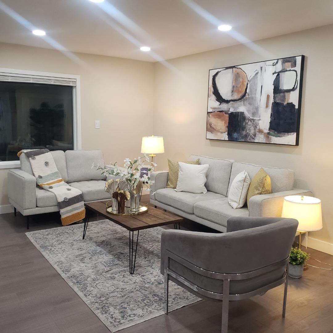 3579 Rowley Drive San Jose, CA 95132 - Photo 2 of 5 a living room with furniture and a flat screen tv