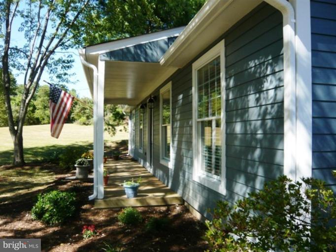 9467 Old Waterloo Road Warrenton, VA 20186 - Photo 13 of 13 a view of a house with backyard and garden