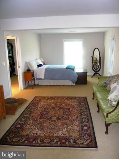 9467 Old Waterloo Road Warrenton, VA 20186 - Photo 7 of 13 a bedroom with a bed and window