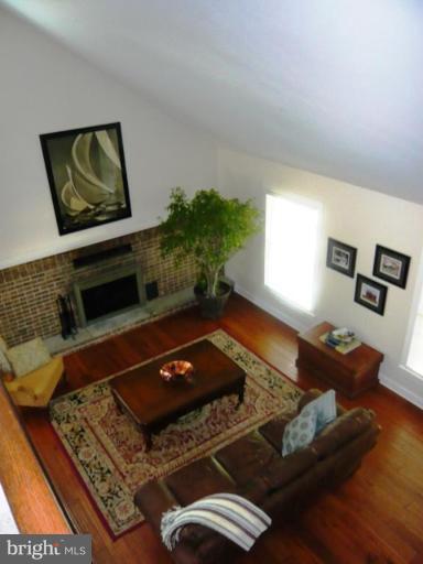9467 Old Waterloo Road Warrenton, VA 20186 - Photo 8 of 13 a living room with a couch and a potted plant