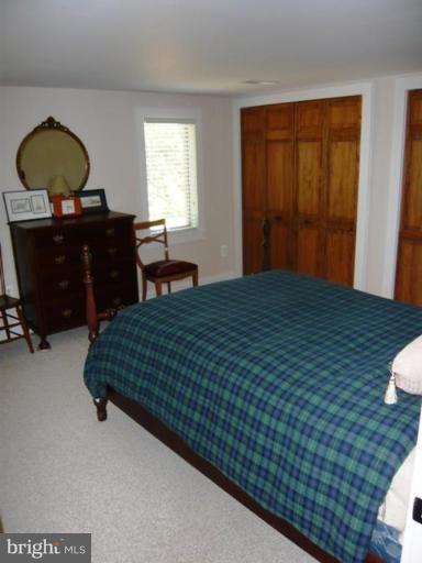 9467 Old Waterloo Road Warrenton, VA 20186 - Photo 9 of 13 a bedroom with a bed and a dresser