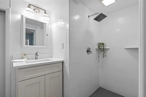 a bathroom with a sink and mirror